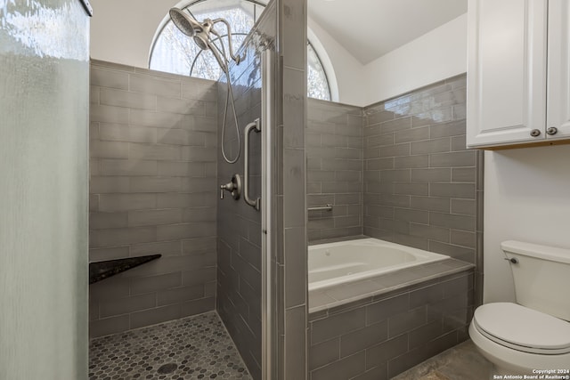 bathroom with tile flooring, a wealth of natural light, toilet, and independent shower and bath