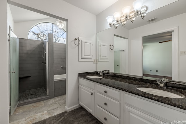 bathroom featuring tile flooring, dual sinks, and large vanity