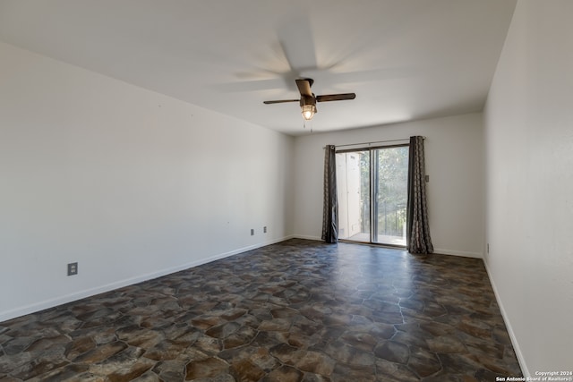 tiled empty room with ceiling fan