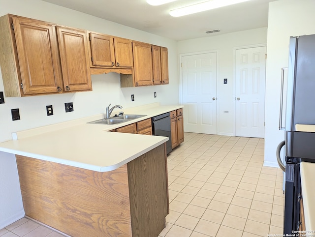 kitchen with range, stainless steel fridge, sink, black dishwasher, and light tile floors