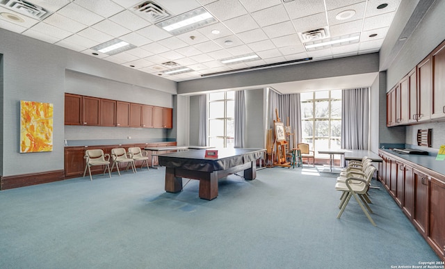 game room featuring carpet flooring and a drop ceiling