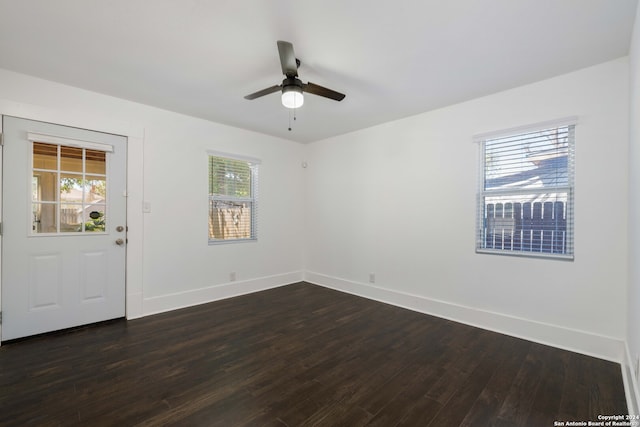 empty room featuring ceiling fan and hardwood / wood-style floors