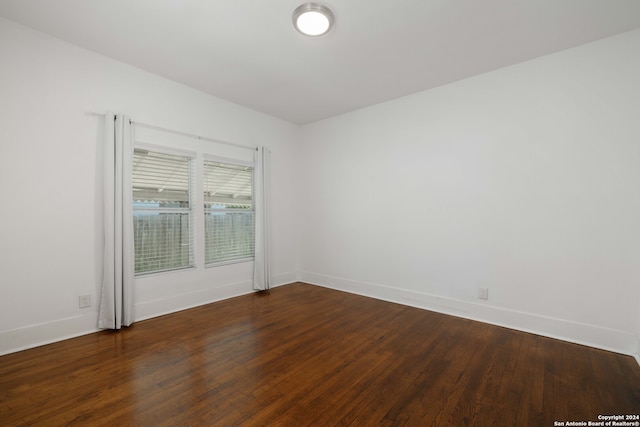 spare room with hardwood / wood-style flooring