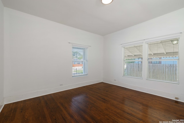 empty room with hardwood / wood-style floors