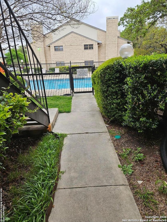 view of patio featuring a community pool