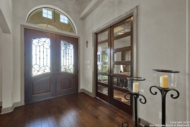 foyer entrance featuring french doors and dark hardwood / wood-style flooring