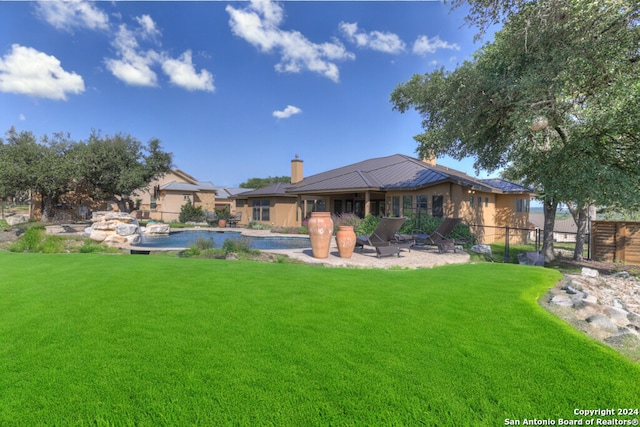 rear view of house with a lawn