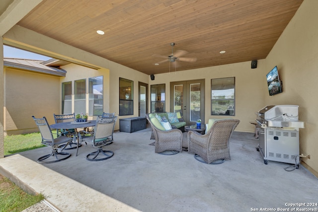 view of patio / terrace featuring ceiling fan and an outdoor living space