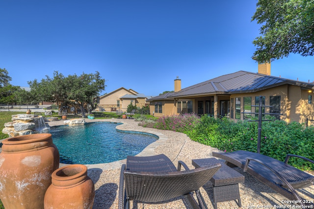 view of pool featuring a patio and pool water feature