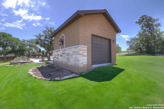 garage with a yard