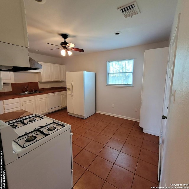 kitchen featuring white cabinetry, ceiling fan, light tile flooring, white appliances, and sink