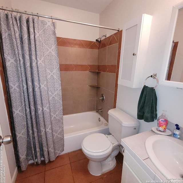 full bathroom with shower / bath combo, toilet, vanity, and tile floors