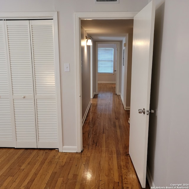 hallway featuring dark wood-type flooring