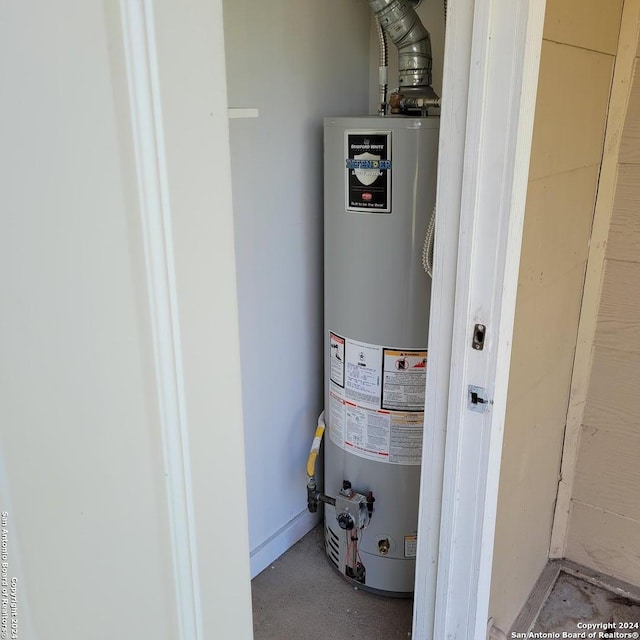 utility room featuring gas water heater