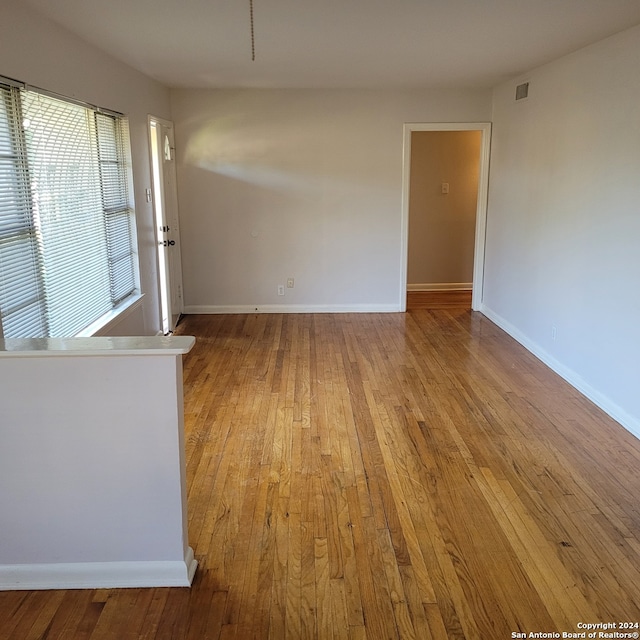 spare room with light hardwood / wood-style floors