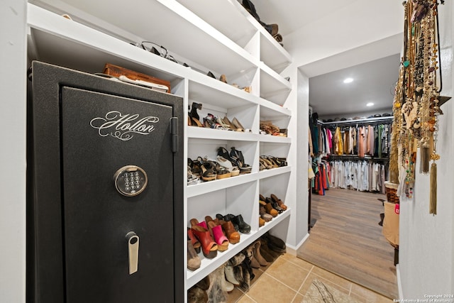 spacious closet with light hardwood / wood-style flooring