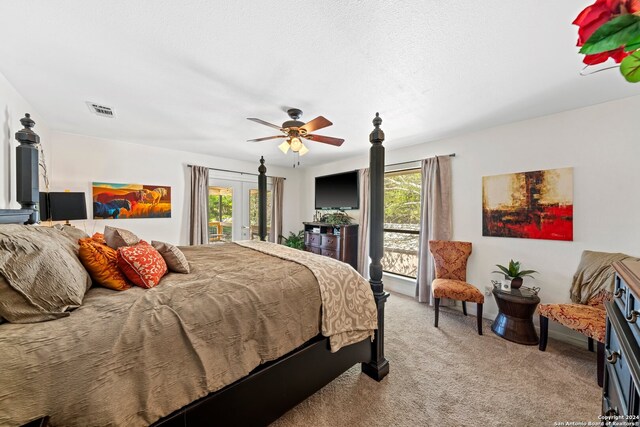 carpeted bedroom featuring french doors, access to outside, and ceiling fan