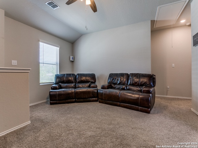 carpeted living room featuring vaulted ceiling and ceiling fan