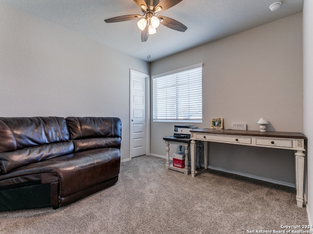 carpeted living room featuring ceiling fan