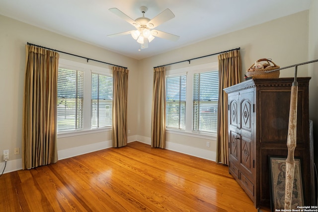 spare room featuring ceiling fan and light hardwood / wood-style floors