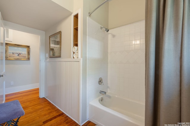 bathroom featuring shower / bathtub combination with curtain and wood-type flooring