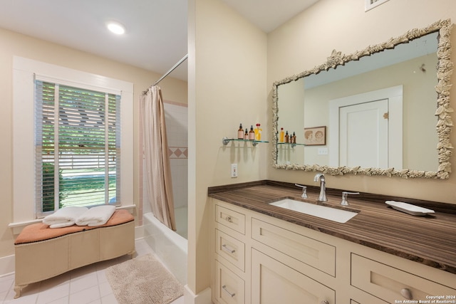 bathroom with tile floors, vanity, and shower / bath combo