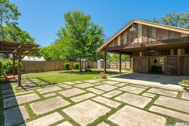 view of yard with central AC, a shed, and a patio