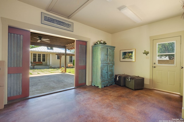 interior space featuring ceiling fan