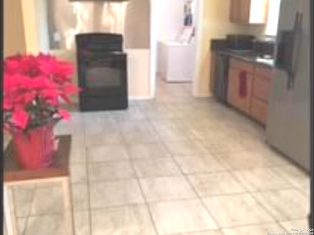 kitchen featuring light tile floors