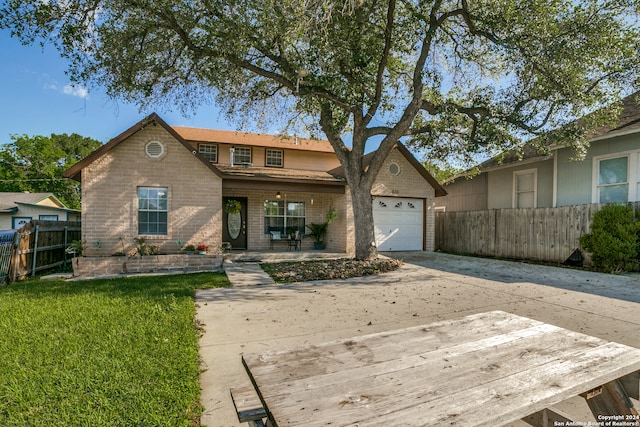 view of front facade with a front lawn and a garage