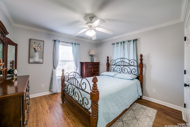 bedroom with ornamental molding, ceiling fan, and hardwood / wood-style floors