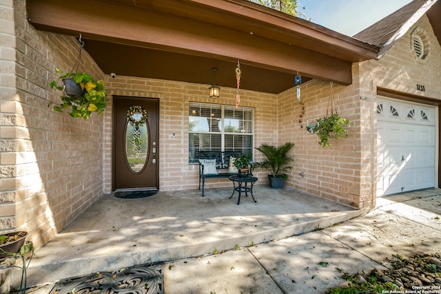 property entrance with a garage