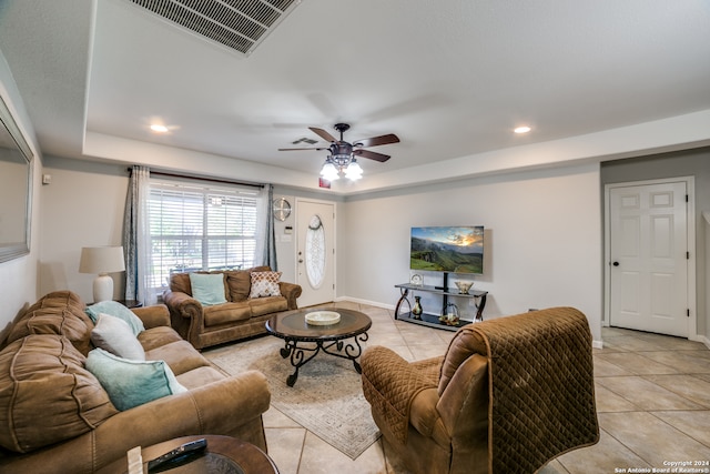 living room featuring ceiling fan and light tile floors