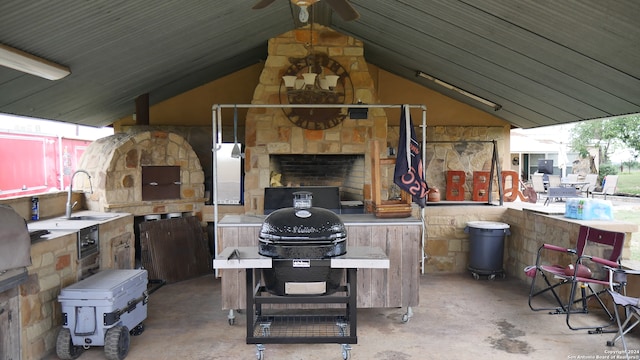 view of terrace with grilling area and sink