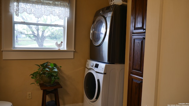 laundry room with stacked washer and clothes dryer