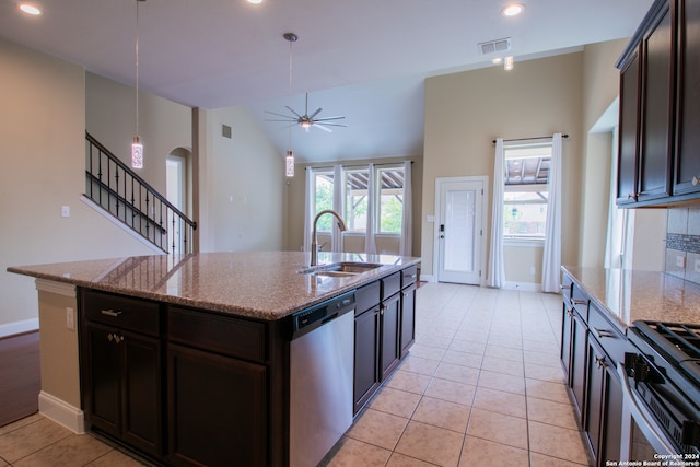 kitchen with an island with sink, ceiling fan, appliances with stainless steel finishes, hanging light fixtures, and sink