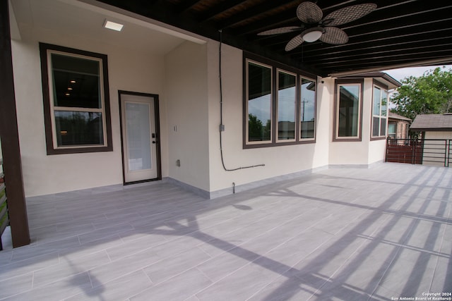 view of patio featuring ceiling fan