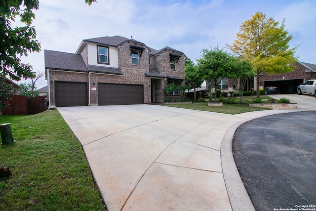 view of front facade featuring a front yard and a garage