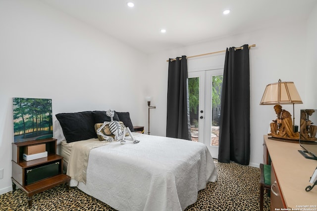 bedroom with access to exterior, french doors, and carpet flooring