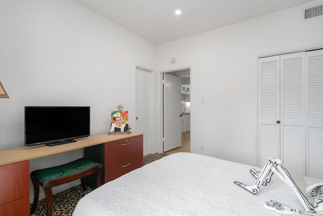 bedroom with carpet floors and a closet