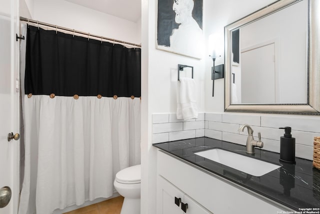 bathroom with decorative backsplash, vanity, a shower with shower curtain, tile patterned floors, and toilet