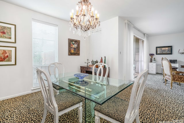 dining room with a notable chandelier