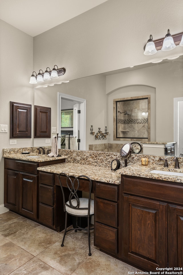 bathroom with tile floors and double sink vanity