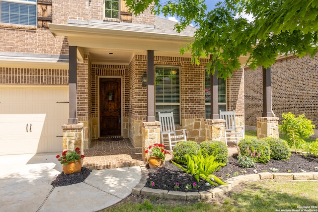 doorway to property featuring a garage