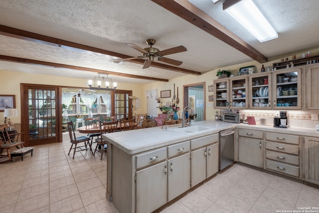 kitchen featuring beamed ceiling, light tile floors, ceiling fan with notable chandelier, dishwasher, and sink