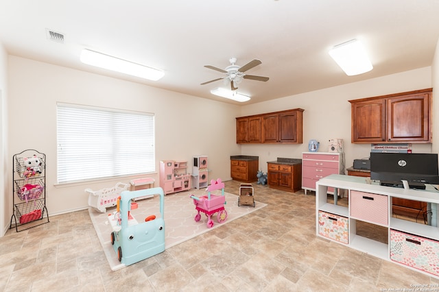 game room featuring ceiling fan and light tile flooring