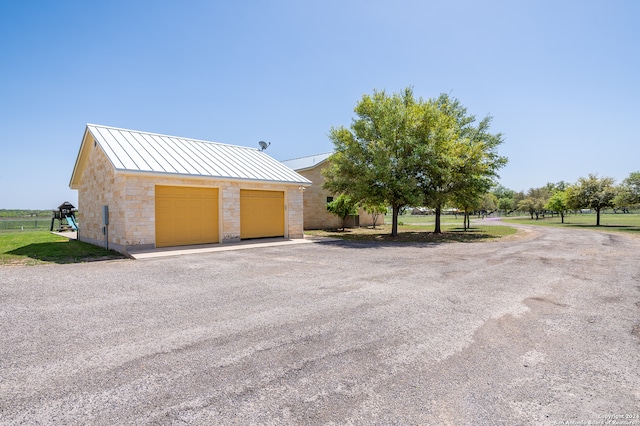 garage with a lawn