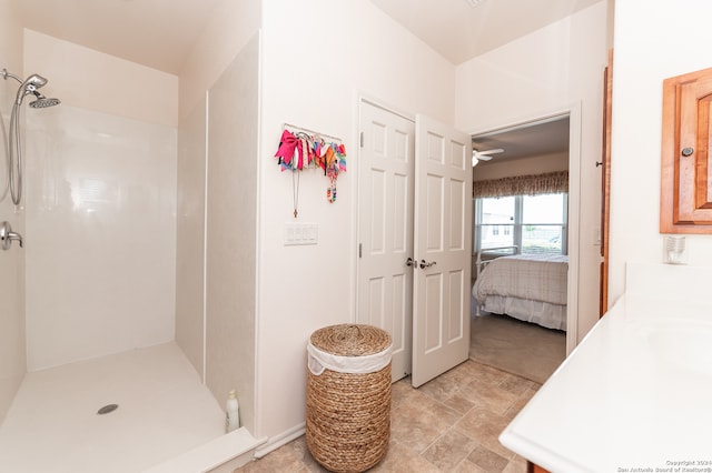 bathroom with tile flooring and a shower