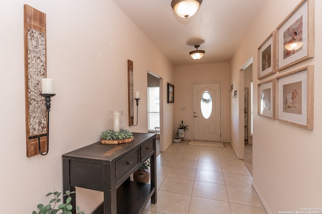 entrance foyer featuring light tile floors