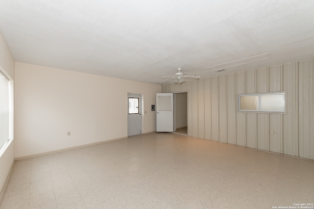 unfurnished room with ceiling fan